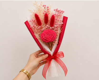 Hand holding the Cherivo Rose Whisper red dried flower bouquet